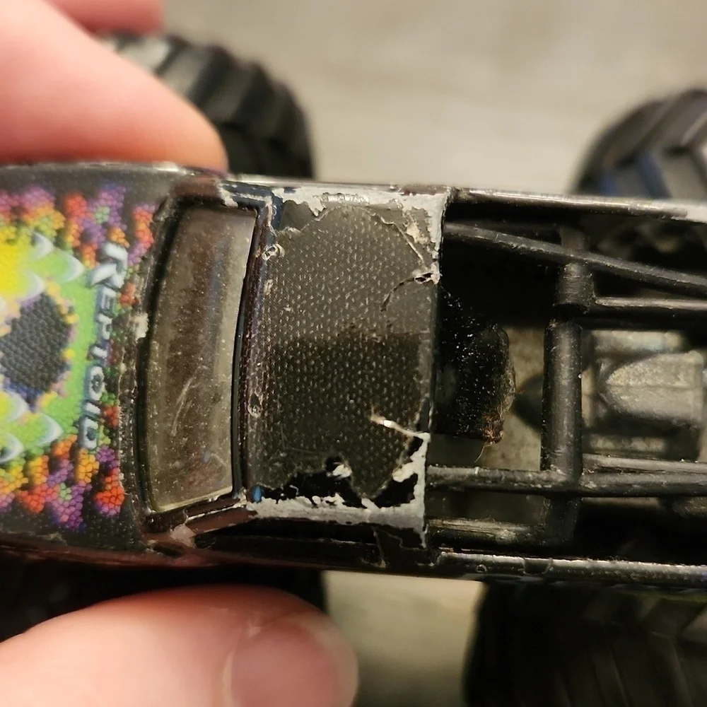 Hotwheels Reptoid 4x4 truck has paint chips flaws metal body